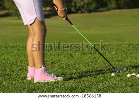 young golf player trying a shot