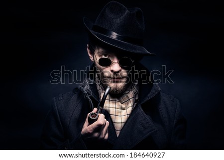 Portrait of man, Sherlock Holmes like character, black background
