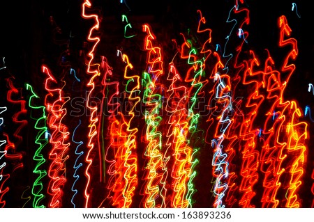 Painting with light using the multicolored bulb christmas - Light painting : long exposure time laps technique in black room