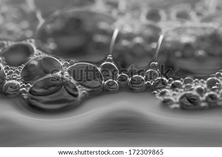 Macro of the surface silver big bubbles soap