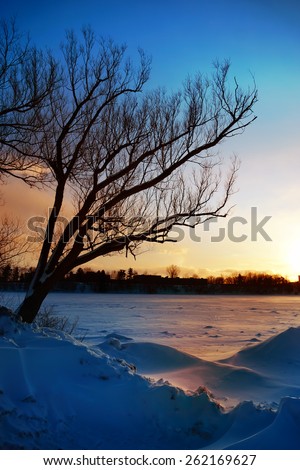 Coldest winter sunset, river landscape, Quebec, Canada