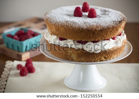 Victoria Sponge Cake with Whipped Cream and Raspberries
