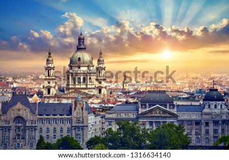 Urban landscape panorama with sunset and old buildings and domes of opera buildings in Budapest, Hungary.