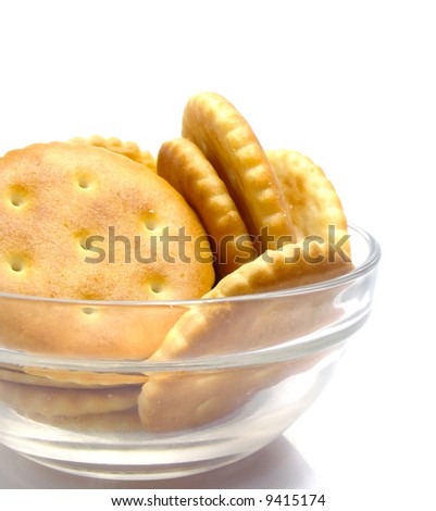 Salt crackers food  in the glass vase isolated over white background