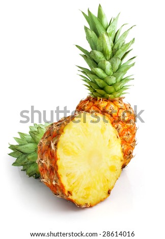 fresh pineapple fruits with cut and green leaves isolated on white background