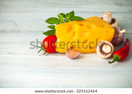 Part cheese with vegetables and basil on wooden board. Illustration