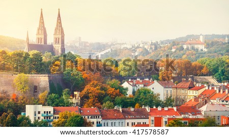 Prague sunset landscape from view to vysehrad church of st peter and paul. Panorama of castle. Autumn cathedral sunset view.