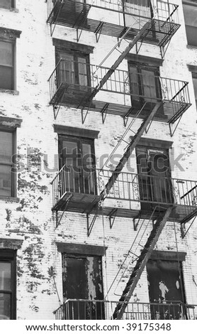 Fire stair outside a building crossing windows