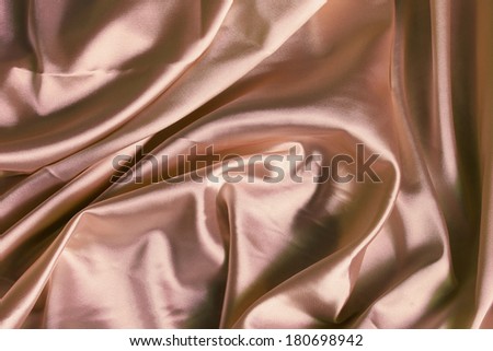 Beige silk draped as a background