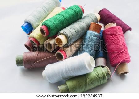 A lot of bobbins with multicolor threads