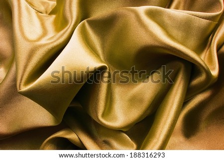 Gold silk draped as a background