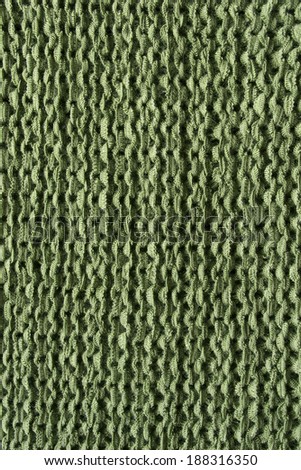Green knitted cloth closeup as a background