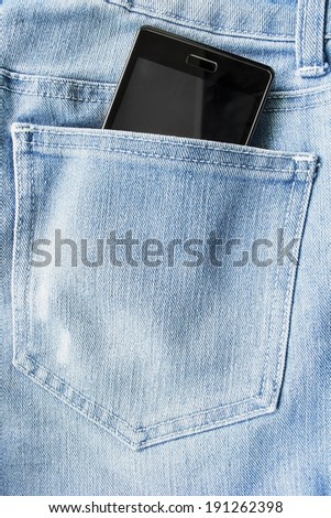 Black cell phone in a jeans back pocket