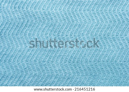 Texture of cyan knitted cloth as a background