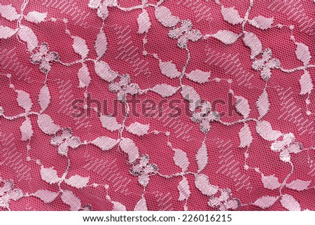 White floral ornament lace on red as a background