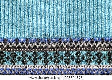 Blue ornamental knitted cloth closeup as a background
