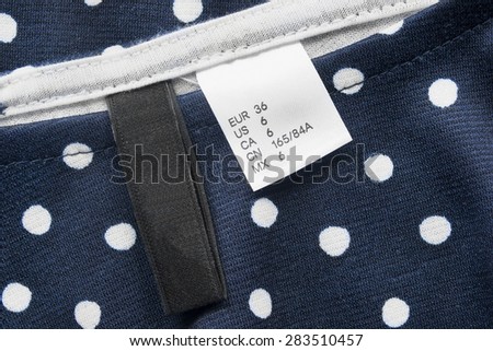 Black and white clothes labels as a background
