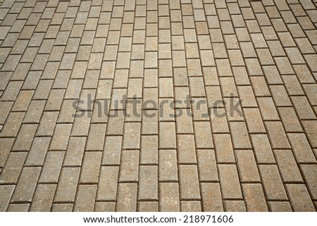 stone road from cement blocks background