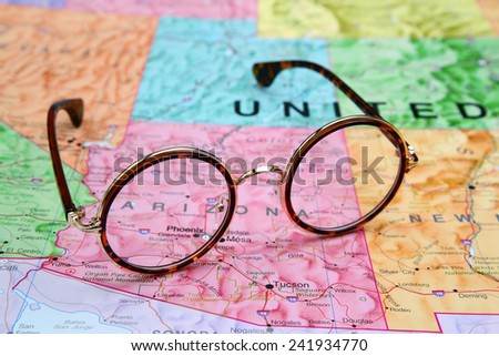Glasses on a map of USA - Arizona