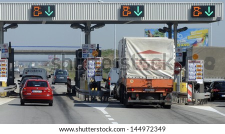 Novi Sad, Serbia - Circa July 2013: Drivers Pays Road Toll At E-75 Highway On Corridor 10 Circa July 2013 In Novi Sad