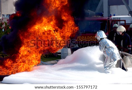 BELGRADE, SERBIA - CIRCA SEPTEMBER 2003: Firefighters practices put the fire out with foam, circa September 2003 in Belgrade