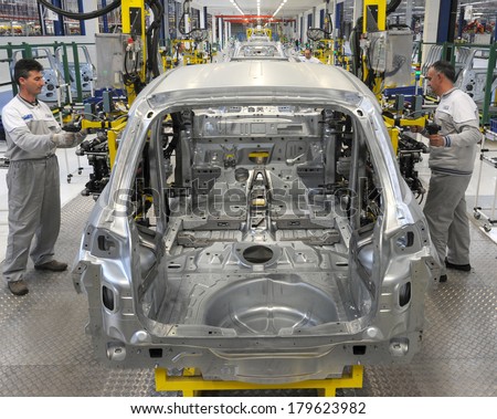 KRAGUJEVAC SERBIA CIRCA APRIL 2012 Workers assembles cars at Fiat Cars Serbia factory circa April 2012 in Kragujevac KRAGUJEVAC SERBIA CIRCA APRIL 2012 Workers assembles cars at Fiat Cars Serbia factory circa April 2012 in Kragujevac