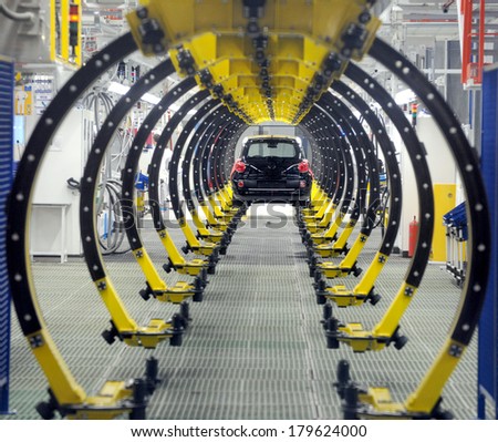 KRAGUJEVAC SERBIA CIRCA APRIL 2012 Workers assembles cars at Fiat Cars Serbia factory circa April 2012 in Kragujevac KRAGUJEVAC SERBIA CIRCA APRIL 2012 Workers assembles cars at Fiat Cars Serbia factory circa April 2012 in Kragujevac