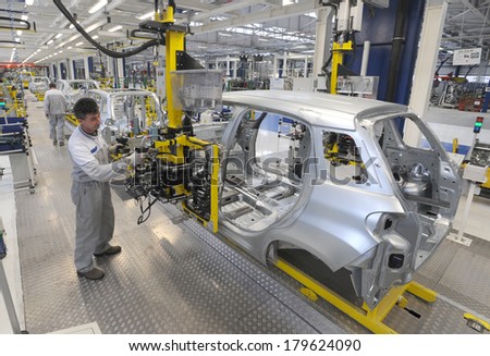 KRAGUJEVAC SERBIA CIRCA APRIL 2012 Workers assembles cars at Fiat Cars Serbia factory circa April 2012 in Kragujevac KRAGUJEVAC SERBIA CIRCA APRIL 2012 Workers assembles cars at Fiat Cars Serbia factory circa April 2012 in Kragujevac