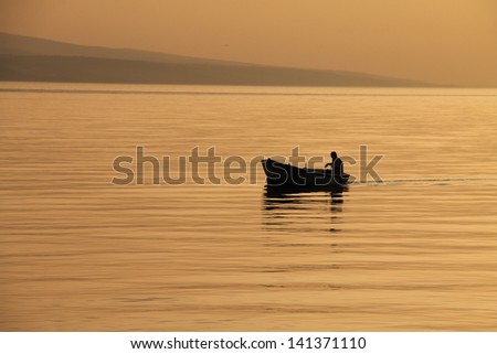 Small boat with beautiful sunset , Croatia moments