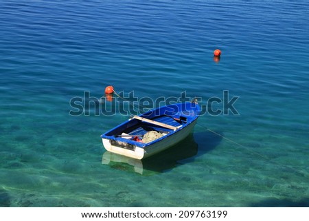 Small blue boat in Adriatic sea , Croatia moments