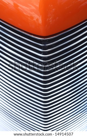 Closeup of hood and Grill of an Orange Custom Hotrod