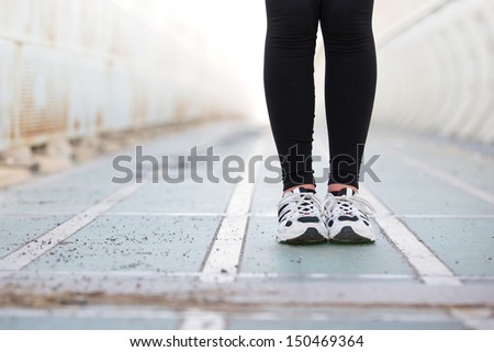 Closeup of female legs. runner shoes outdoor.