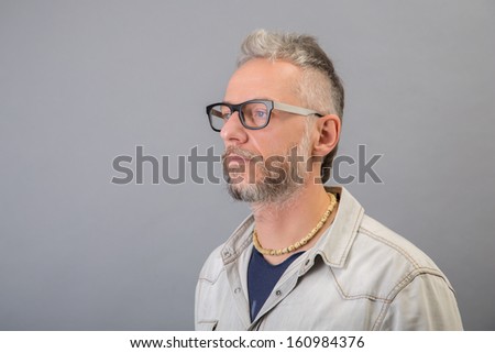 portrait of caucasian mature man looking at right - left profile