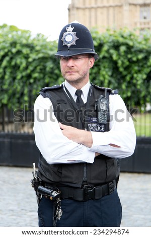 London, UK March 28 2014: portrait of British police near the House of Parliament located in north end of the Palace of Westminster in London