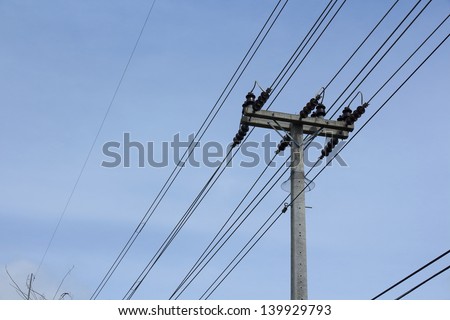 Energy and technology, electrical post with power line cables.