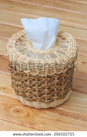 Wicker Tissue Box put on Wooden Table.