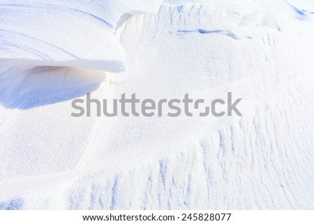 Snow hilsl blue and white frozen texture