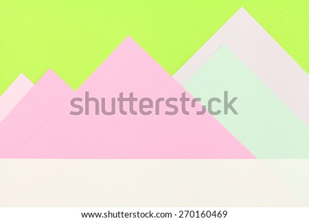 Color papers geometry flat composition background with green and rose tones