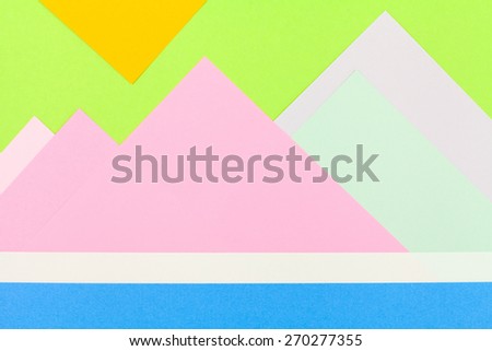 Color papers geometry flat composition background with green rose blue and yellow tones