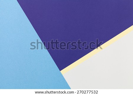 Color papers geometry flat composition background with blue grey and light yellow tones