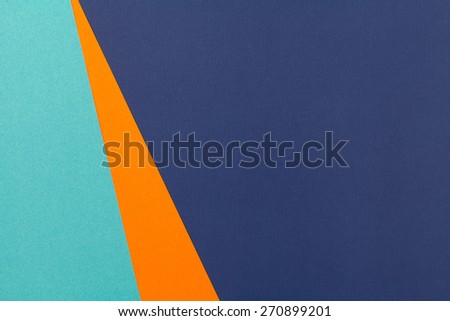 Color papers geometry flat composition background with blue and orange tones