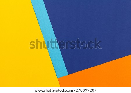 Color papers geometry flat composition background with blue yellow and orange tones