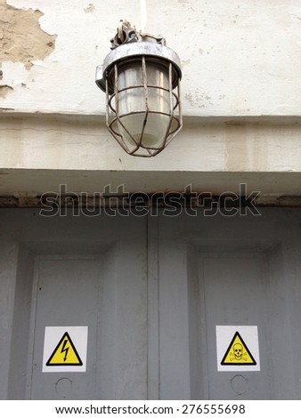 Old abandoned factory lamp and signs