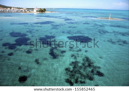 Direct above view on sea harbor.Beautiful landscape with transparent turquoise sea on Peloponnese/Greece Island in Ionian sea