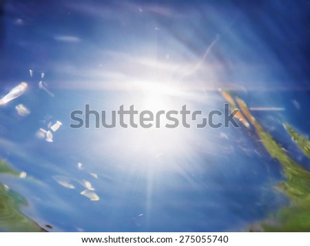 Defocused underwater sea background. Blue transparent turquoise water with sun highlight/Defocused  underwater sea surface background
