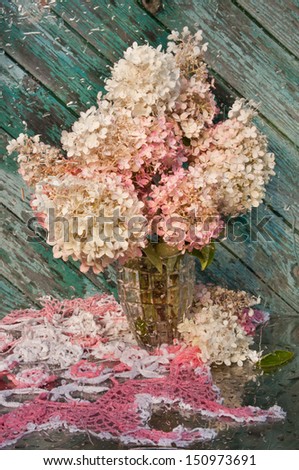 wet still life with pink hydrangea bouquet