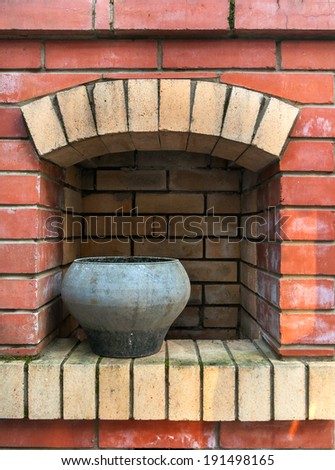 metal pan in a brick fireplace