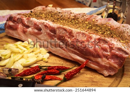 Fresh pork ribs, meat marinated and prepared for roast