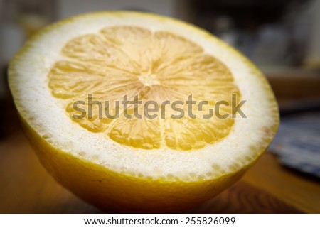 Lemon cut in half on a table close up view