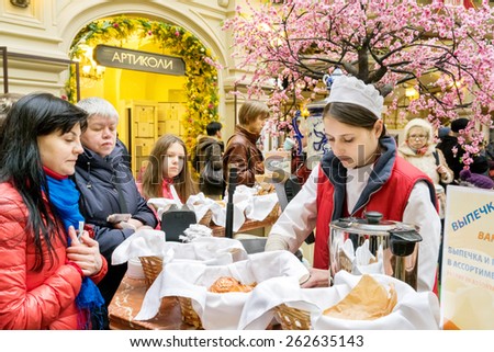 MOSCOW - MARCH 22: People buying bread and tea in the GUM store on March 22, 2015 in Moscow. GUM is a store where it is possible to buy everything, artistic gallery, place to organize cultural events.